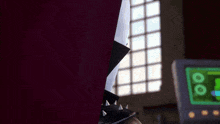 a close up of a person 's leg with spikes on it in a room .
