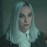 a woman with blue hair is saying `` fuck it '' while looking at the camera .