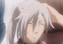 a man with long white hair and a ponytail has his hand on his forehead
