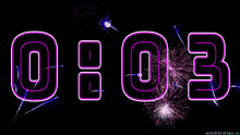 a fireworks display with a neon sign that says 00:00