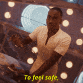 a man in a white shirt says " to feel safe " in yellow letters