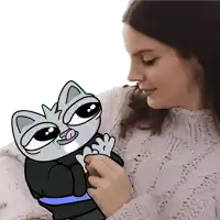 a woman in a sweater is holding a cartoon cat in her lap