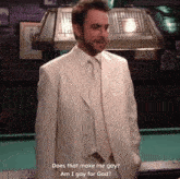 a man in a white suit stands in front of a pool table and says does that make me gay am i gay for god