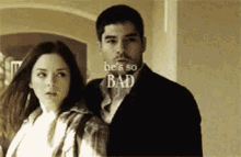 a man and a woman are standing next to each other with the words " he 's so bad " written above them