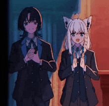 a man and a girl are standing next to each other in a room .