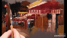 a painting of a building is being painted by a person