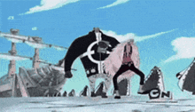 a couple of people standing next to each other in front of a large monster .