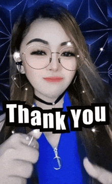 a woman wearing glasses giving a thumbs up and the words thank you behind her