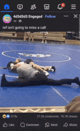 a facebook page with a picture of a wrestler and referee