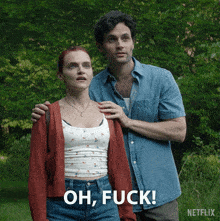 a man and a woman are standing next to each other and the woman says " oh fuck "
