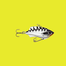 a fishing lure is surrounded by knives and scissors