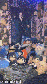 a bunch of stuffed animals are laying on a bed in front of a wall that says nsaw m