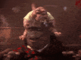 a baby is sitting on a dinosaur 's head and says i 'm gonna bite you now
