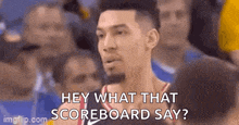 a basketball player is talking to the crowd during a game and saying `` hey what that scoreboard say '' .
