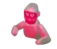 a pink monkey with a red face and glasses on