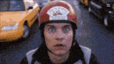 a man wearing a red helmet with a sticker on it that says ' cherry '