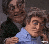 a puppet is being held by another puppet and the words imgplay are on the bottom of the image