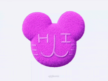 a purple mickey mouse pillow with the letter h and i written on it .