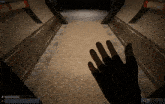 a person 's hand is reaching out in a hallway in a video game that says 6 ms