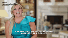 a woman in a blue dress says " i 've decided to abort mission "