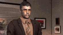 a man in a suit and tie stands in a room