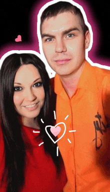 a man in an orange shirt stands next to a woman