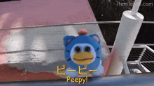 a stuffed animal that says peepy in yellow