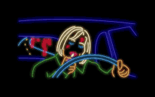a neon sign of a woman driving a car with her eyes closed