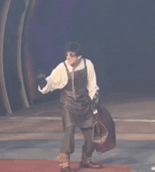a man in an apron is holding a bag and says aa aa aa aa aa
