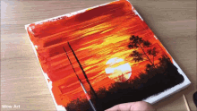 a painting of a sunset with the words wow art on the bottom right