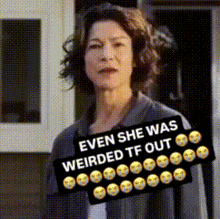 a woman with a sign that says " even she was weirded tf out "