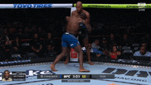 two men are fighting in a boxing ring with a banner that says toyo tires on it