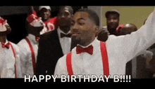 a man in a bow tie and suspenders is standing in front of a crowd of people and says `` happy birthday b ! ''