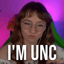 a woman wearing glasses and headphones with the words i 'm unc below her