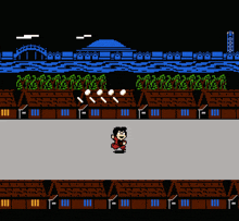 a video game screen shows a man playing a game with houses and a bridge