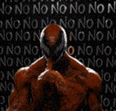 a man in a red suit is standing in front of a wall that says no