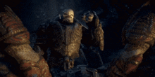 a statue of a man with a beard and horns is standing in the dark