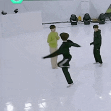 a group of people are standing on a ice rink with korean writing on the bottom .