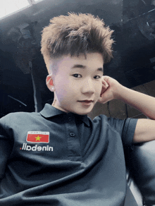 a young man wearing a black shirt that says marlboro