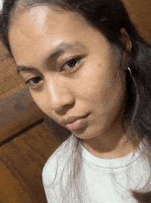 a close up of a woman 's face with long hair