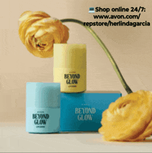 three bottles of avon beyond glow are stacked on top of each other