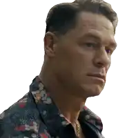 a close up of a man 's face with a floral shirt