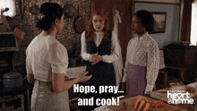 three women standing in a kitchen with the words hope pray and cook on the bottom