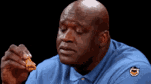 shaq hot wings shocked eating chicken wings