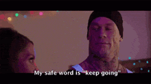 a man with a tattoo on his face is talking to a woman and says " my safe word is keep going " .