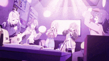 a group of girls singing and playing instruments in a room