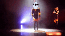 a cartoon of a man with a bunny head on a stage