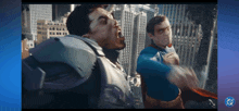 a man in a superman costume is fighting another man in a superhero costume
