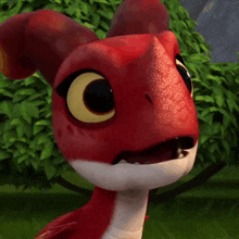 a close up of a red and white cartoon dragon with a surprised look on his face .