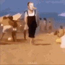 a painting of a man with a long nose on the beach